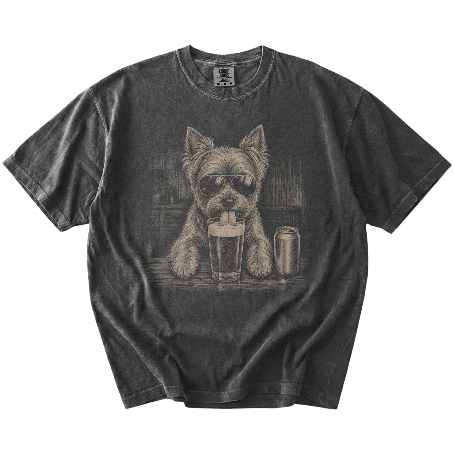 Yorkie sneaking a drink from a foamy pint at home on a Pepper Comfort Colors® t-shirt