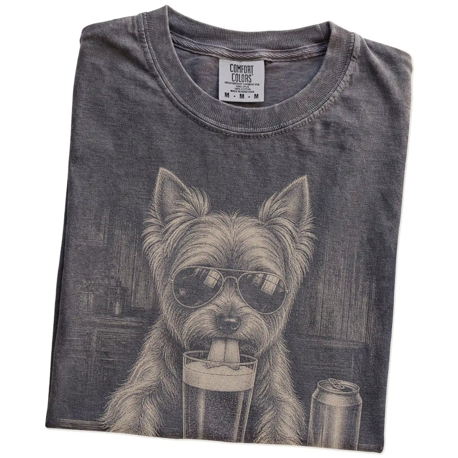 Folded Pepper Comfort Colors® t-shirt showing Yorkie sneaking a drink from a pint