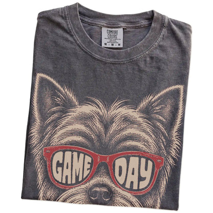 Folded Pepper Comfort Colors® T-shirt showing yorkie wearing red game day sunglasses