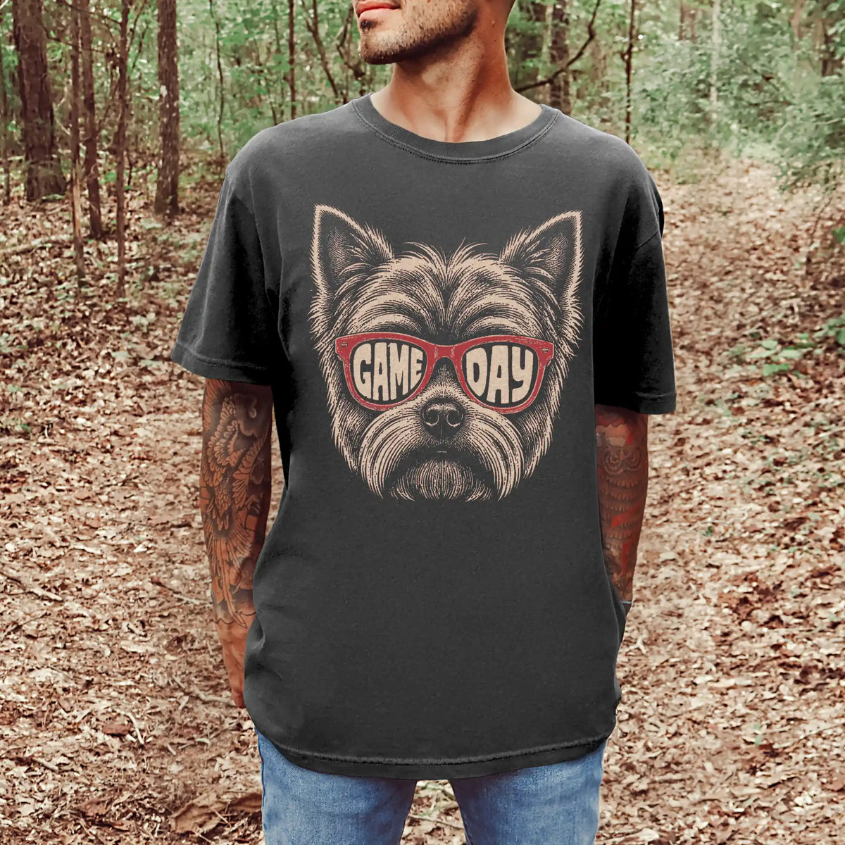 Model wearing a Pepper Comfort Colors® T-shirt with yorkie wearing red game day sunglasses
