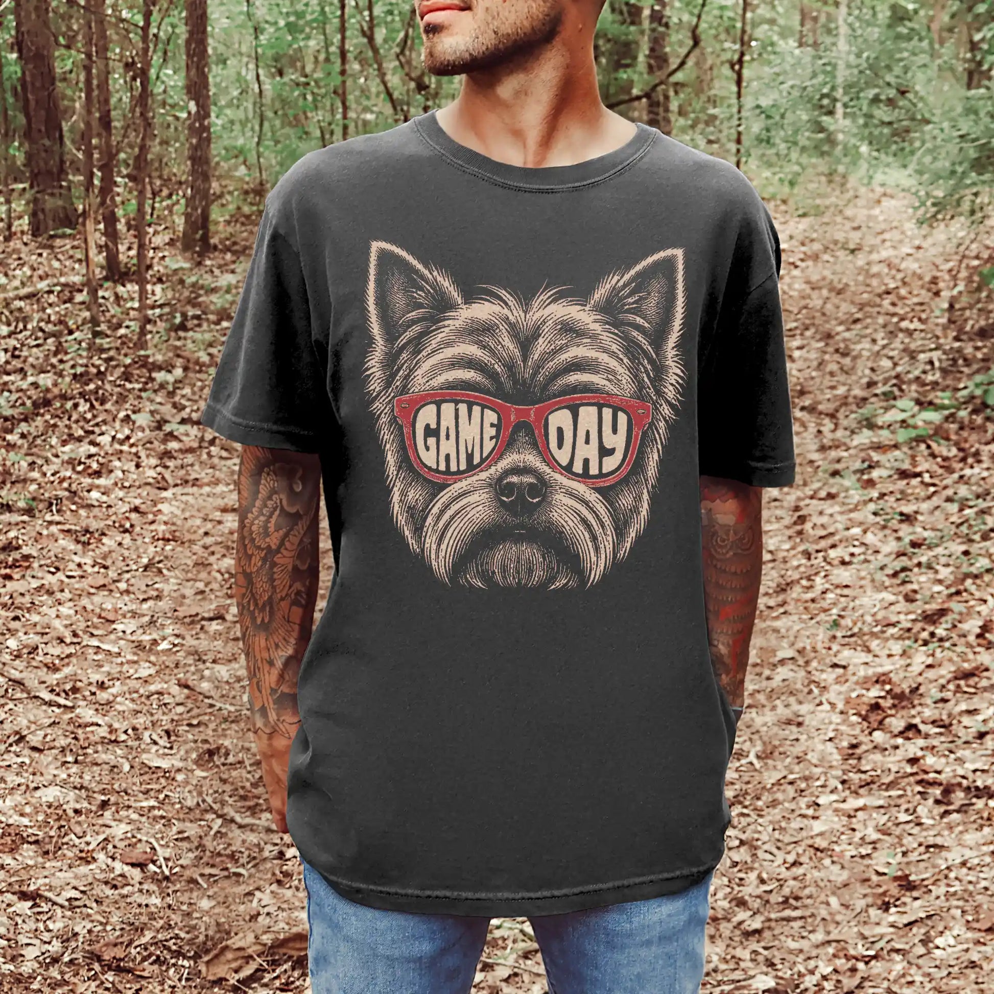Model wearing a Pepper Comfort Colors® T-shirt with yorkie wearing red game day sunglasses