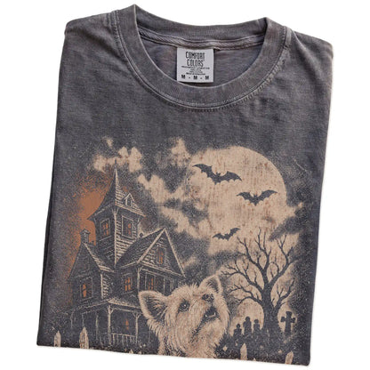 Folded Pepper Comfort Colors® T-shirt showing Yorkie in a vintage haunted-house scene
