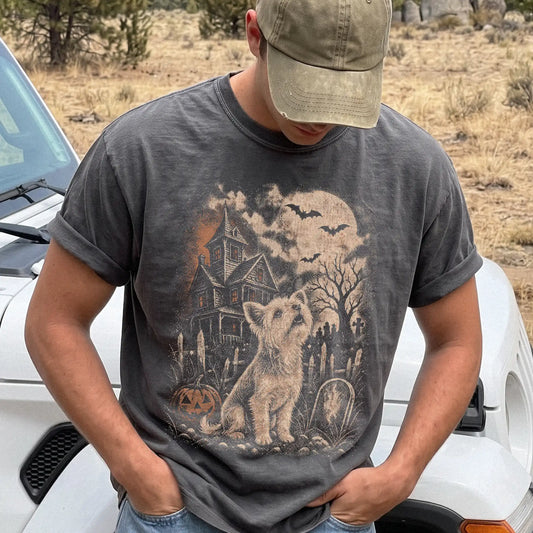 Model wearing a Pepper Comfort Colors® T-shirt showing Yorkie in a vintage haunted-house scene