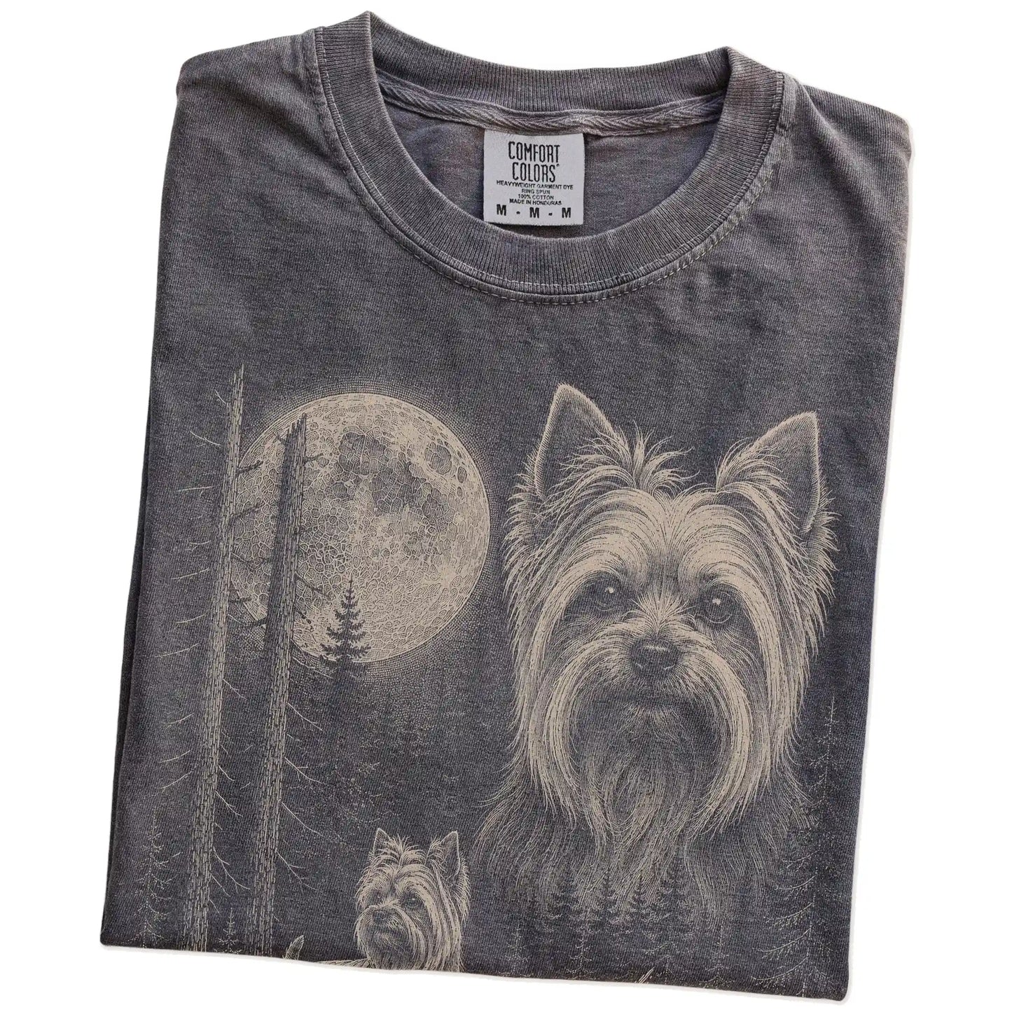 Folded Pepper Yorkie Moonlit Forest T-Shirt showing the graphic