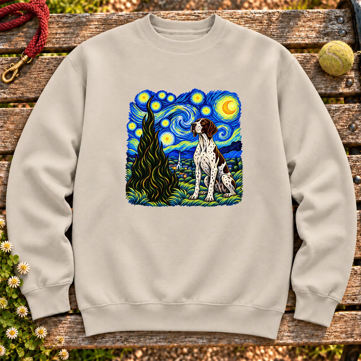 Colorful Pointer beneath a swirling starry night sky on a Sand sweatshirt