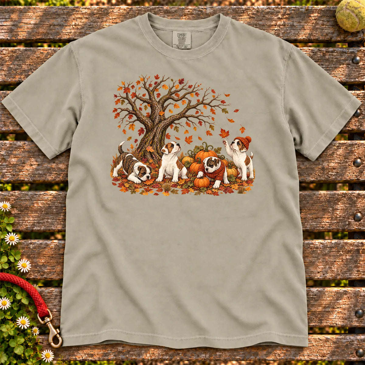 Four American Bulldog puppies with pumpkins beneath an autumn tree on a Sandstone garment-dyed T-shirt