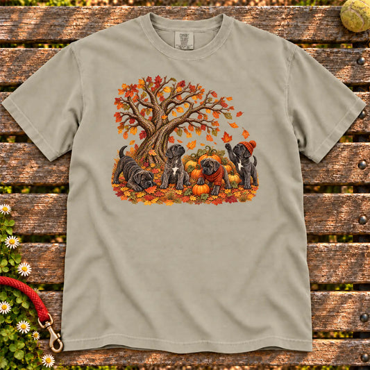 Four Cane Corso puppies with pumpkins beneath an autumn tree on a Sandstone garment-dyed T-shirt