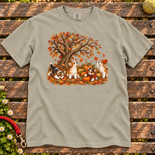 Four Corgi puppies with pumpkins beneath an autumn tree on a Sandstone garment-dyed T-shirt