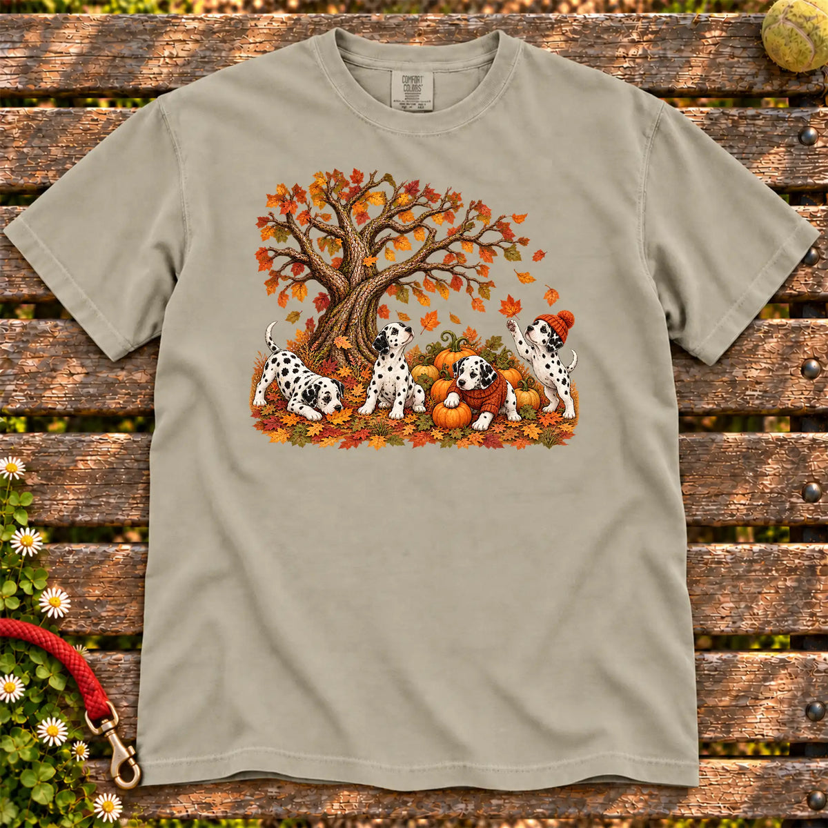 Four Dalmatian puppies with pumpkins beneath an autumn tree on a Sandstone garment-dyed T-shirt