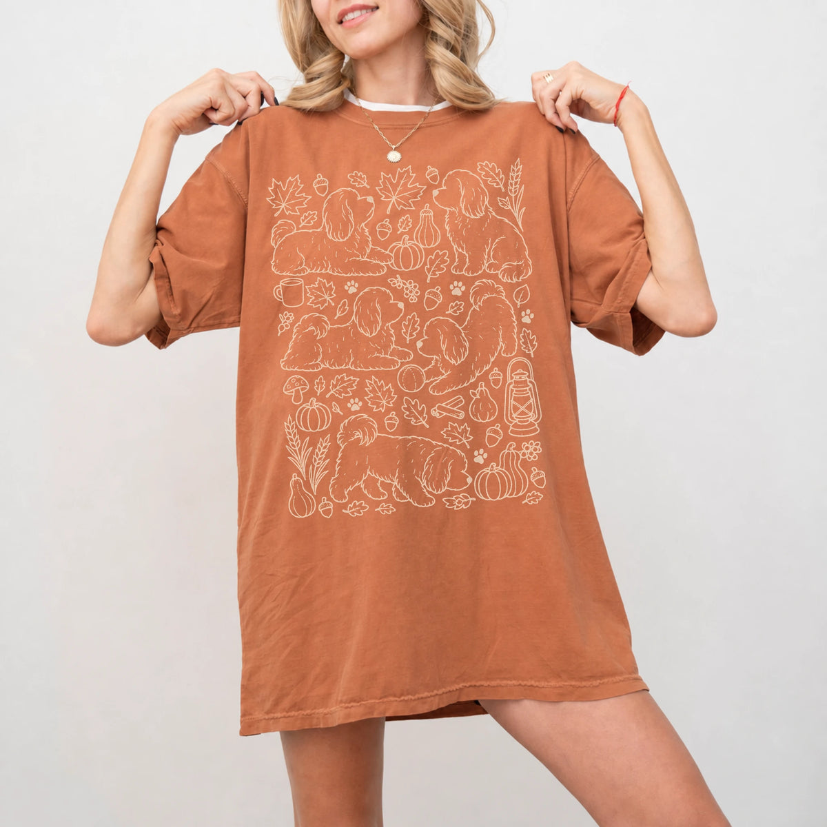 Model wearing a Yam Comfort Colors® T-shirt with Havanese dogs with pumpkins, leaves, acorns, and woodland details