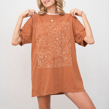 Model wearing a Yam Comfort Colors® T-shirt with Poodle dogs with pumpkins, leaves, acorns, and woodland details