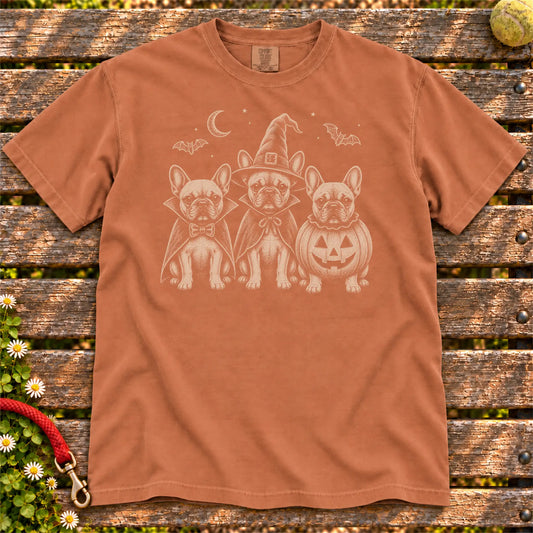 Three French Bulldog dogs dressed for Halloween beneath bats and a crescent moon on a Yam Comfort Colors® T-shirt