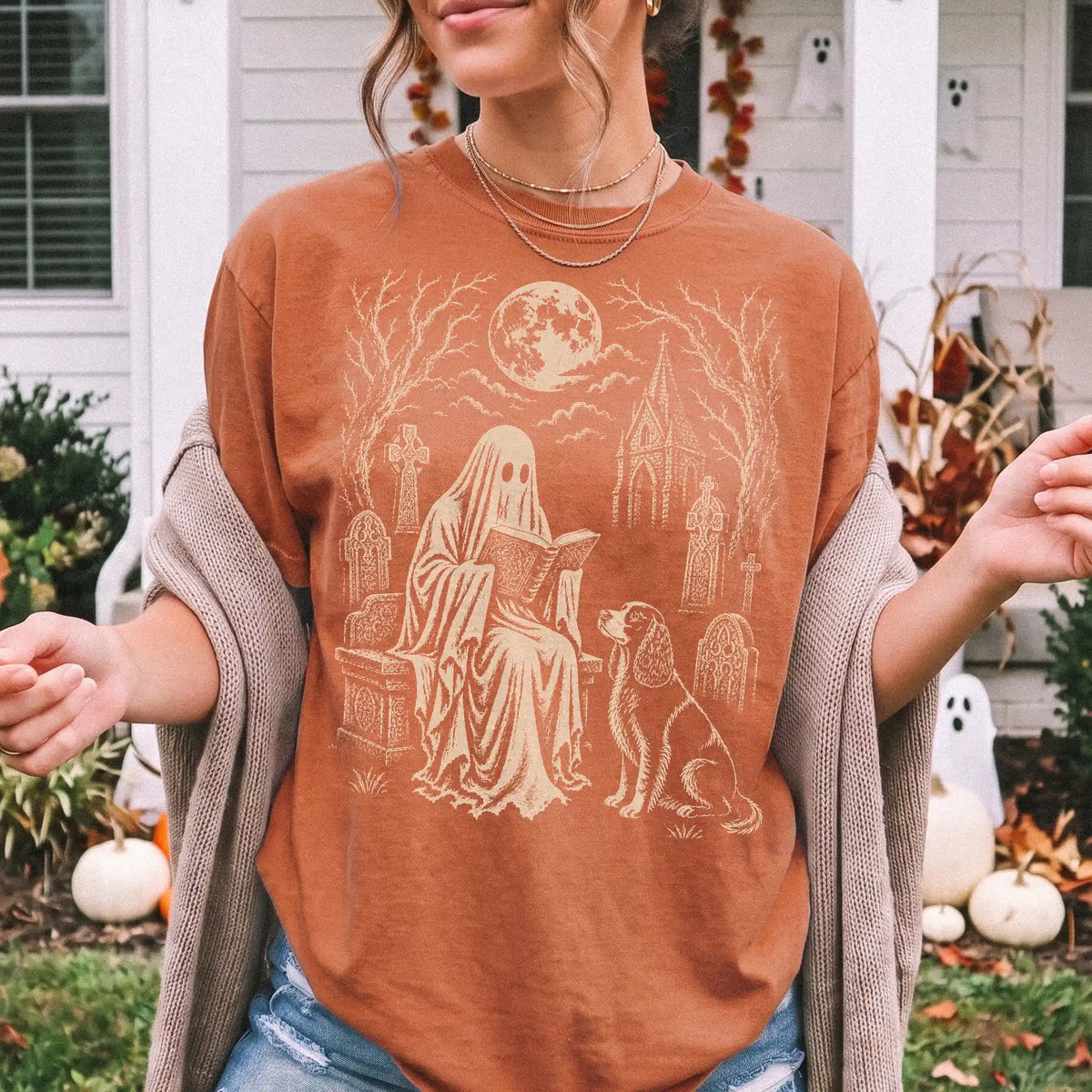 Model wearing a Yam Comfort Colors® T-shirt showing Springer Spaniel beside a reading ghost in a moonlit graveyard