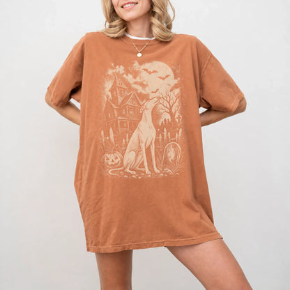 Model wearing a Yam Comfort Colors® T-shirt showing Greyhound in a vintage haunted-house scene