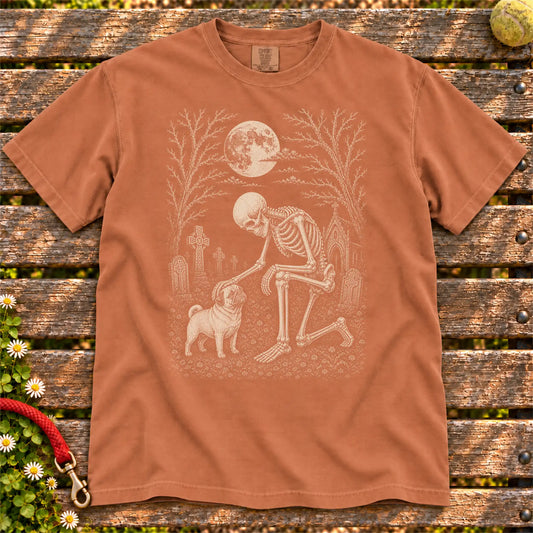 Pug sharing a quiet cemetery moment with a friendly skeleton on a Yam Comfort Colors® T-shirt