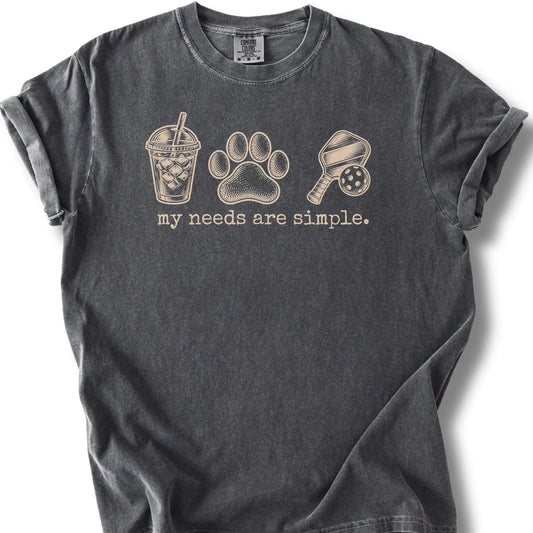Iced coffee, a paw print and a paddle and ball on a pepper T-shirt.