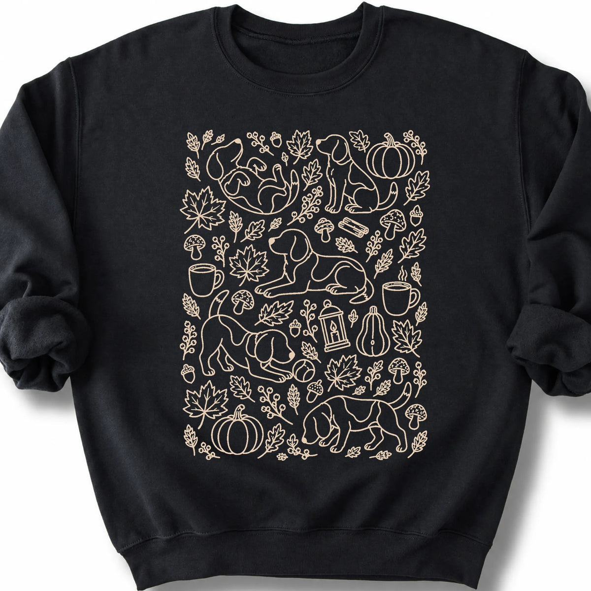 Beagle among autumn leaves and seasonal icons on a black sweatshirt.