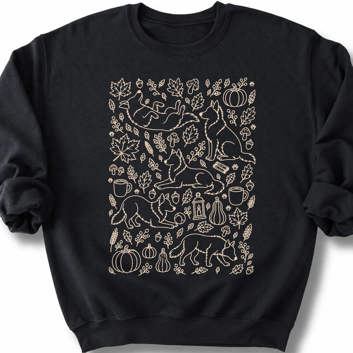 Border Collie among autumn leaves and seasonal icons on a black sweatshirt.