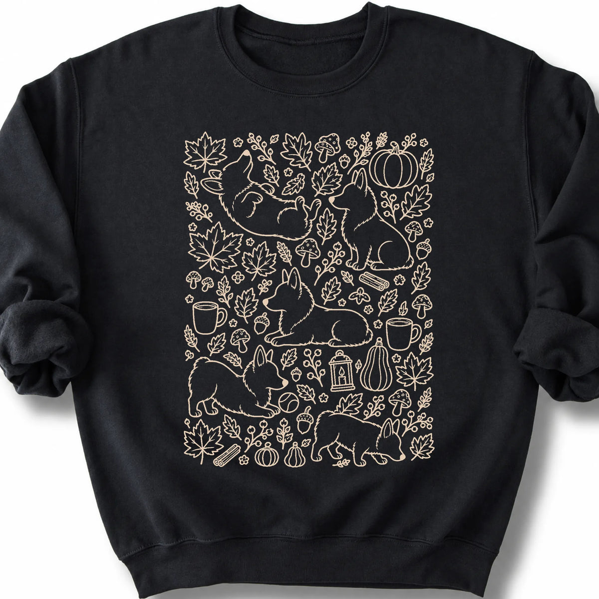 Corgi among autumn leaves and seasonal icons on a black sweatshirt.
