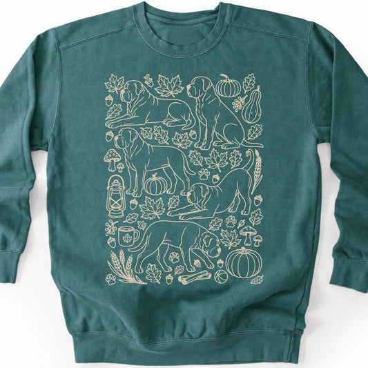Mastiff among autumn leaves and seasonal icons on a blue spruce sweatshirt.