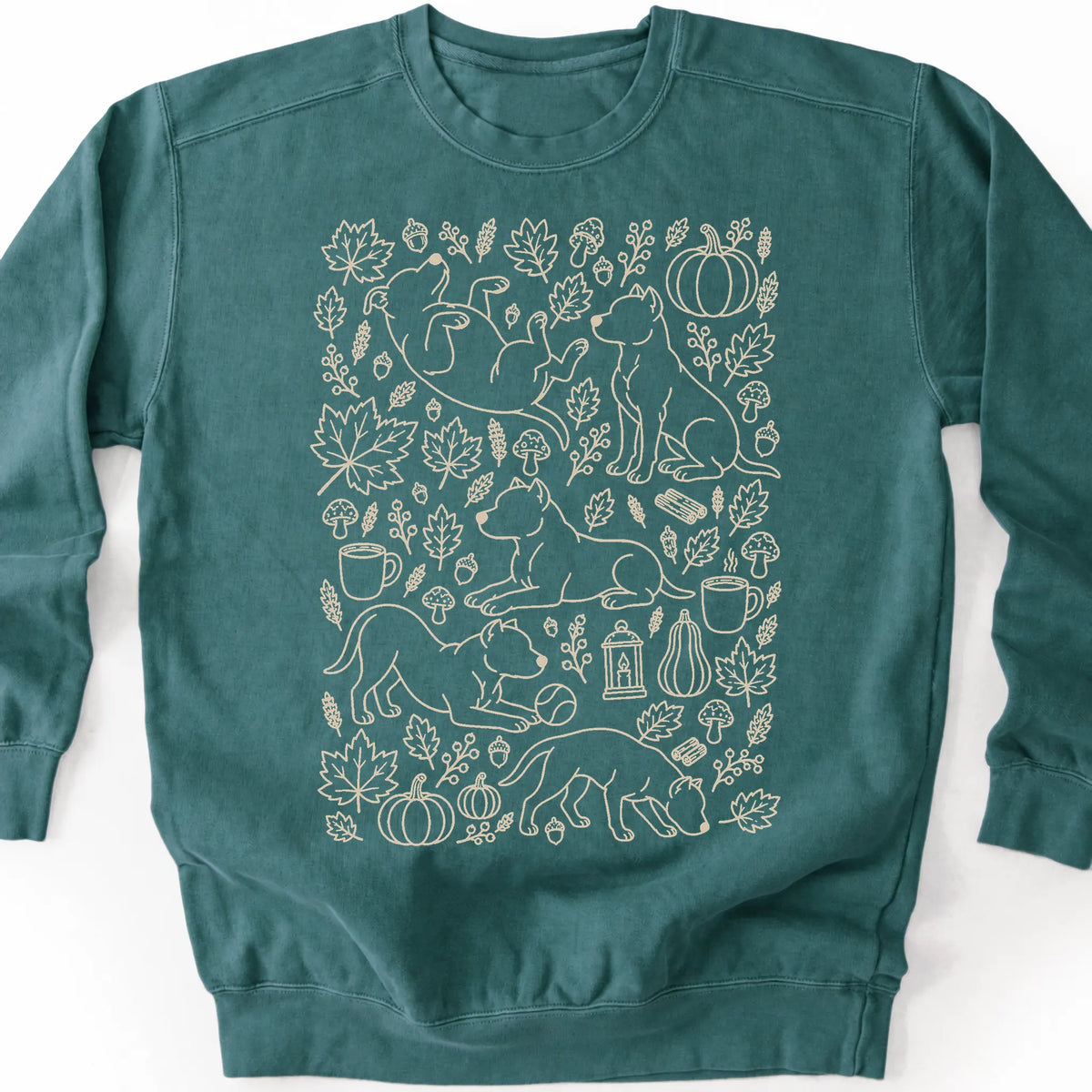 Pitbull among autumn leaves and seasonal icons on a blue spruce sweatshirt.