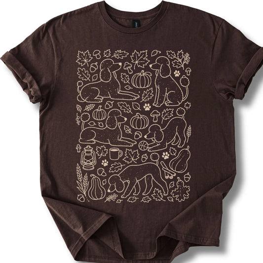 Poodle among autumn leaves and seasonal icons on a dark chocolate T-shirt.