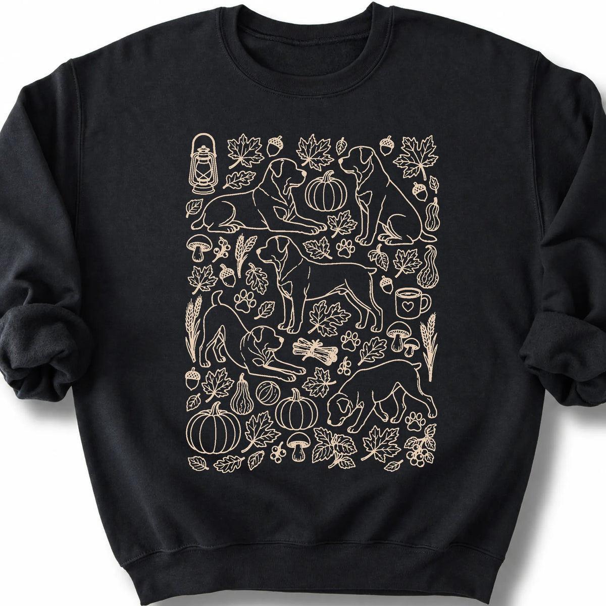 Rottweiler among autumn leaves and seasonal icons on a black sweatshirt.