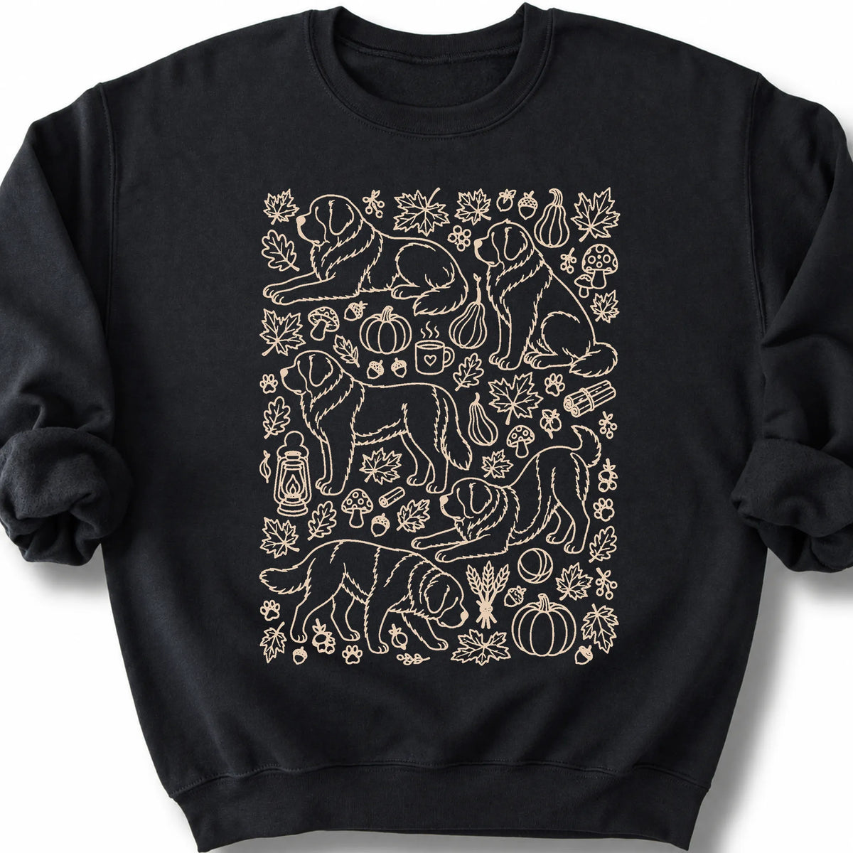 Saint Bernard among autumn leaves and seasonal icons on a black sweatshirt.