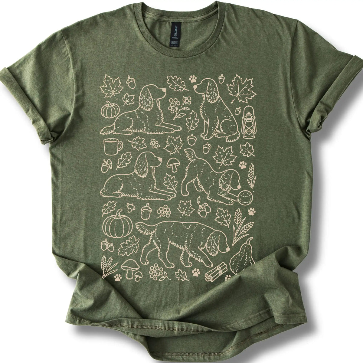 Springer Spaniel among autumn leaves and seasonal icons on a military green T-shirt.