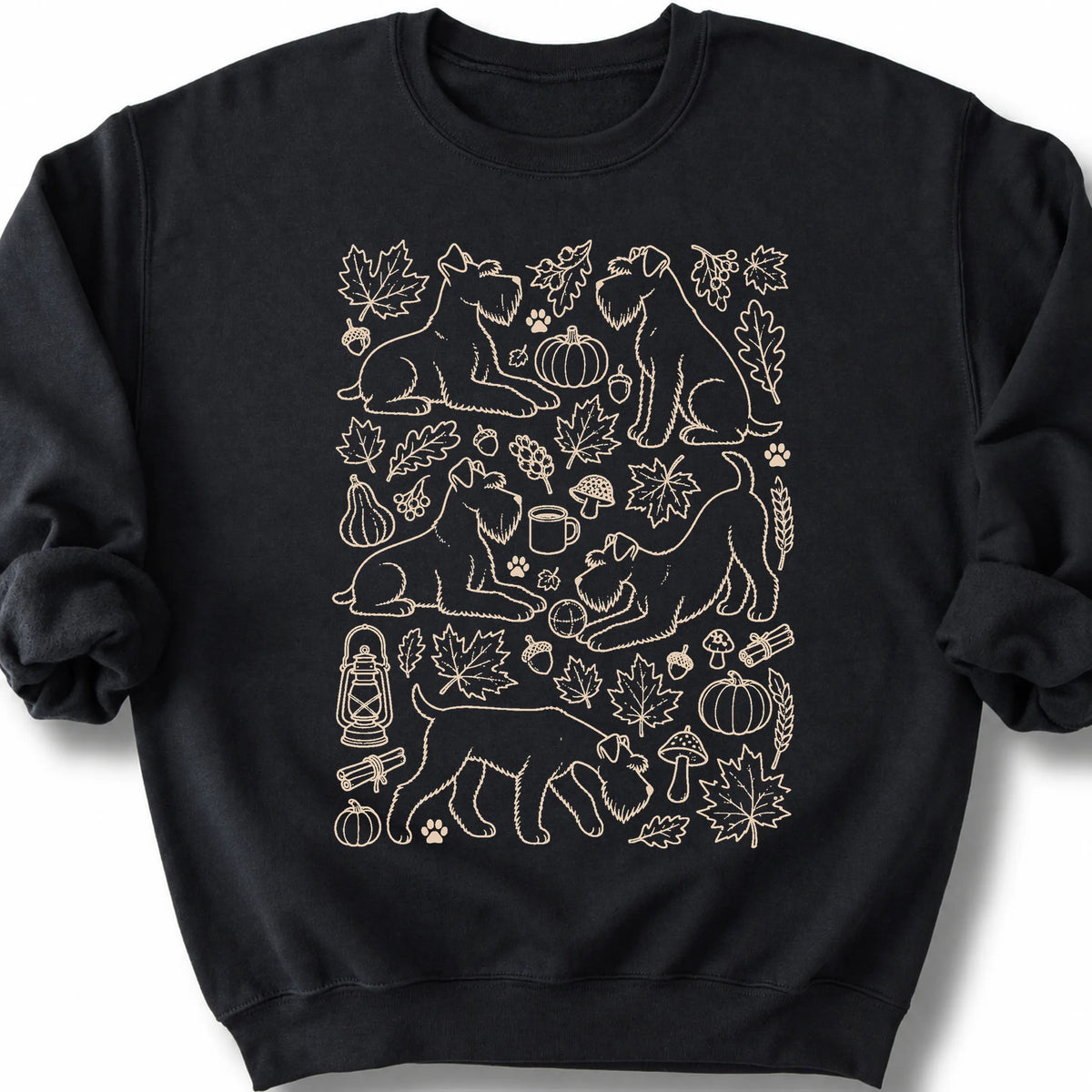 Standard Schnauzer among autumn leaves and seasonal icons on a black sweatshirt.