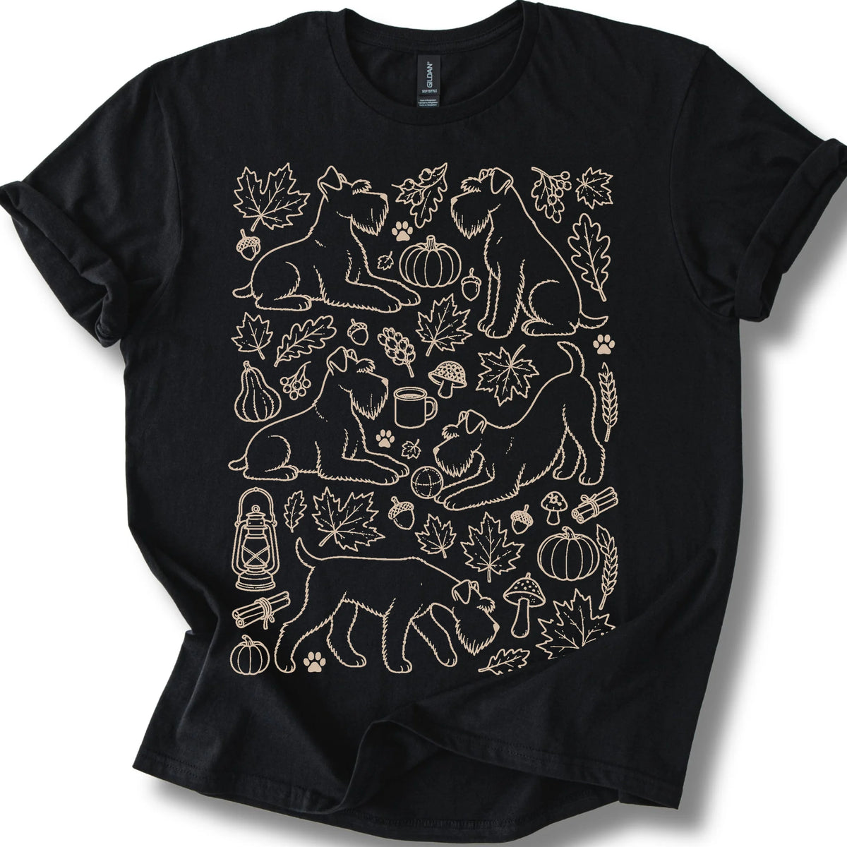Standard Schnauzer among autumn leaves and seasonal icons on a black T-shirt.