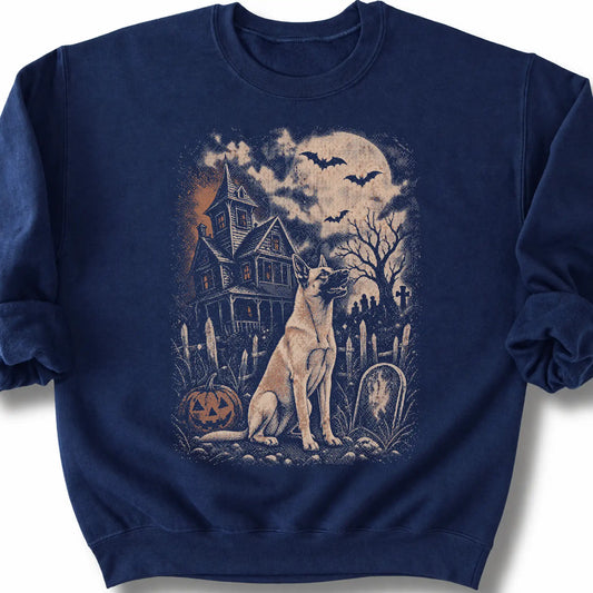 Belgian Malinois beside a haunted house on a navy sweatshirt.