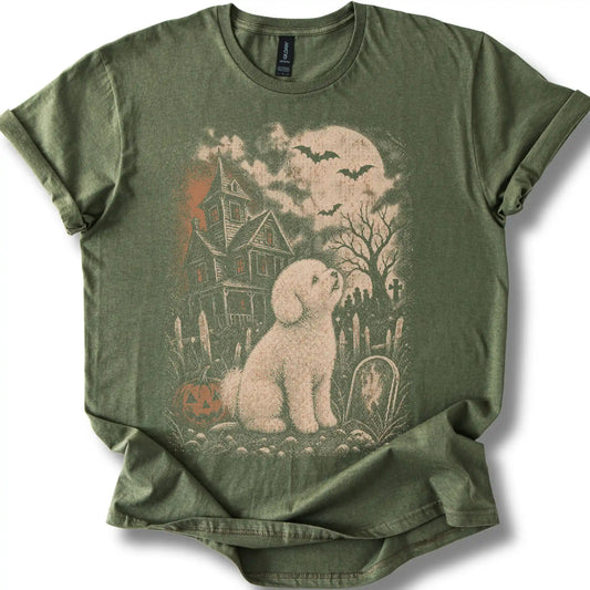Bichon Frise beside a haunted house on a military green T-shirt.