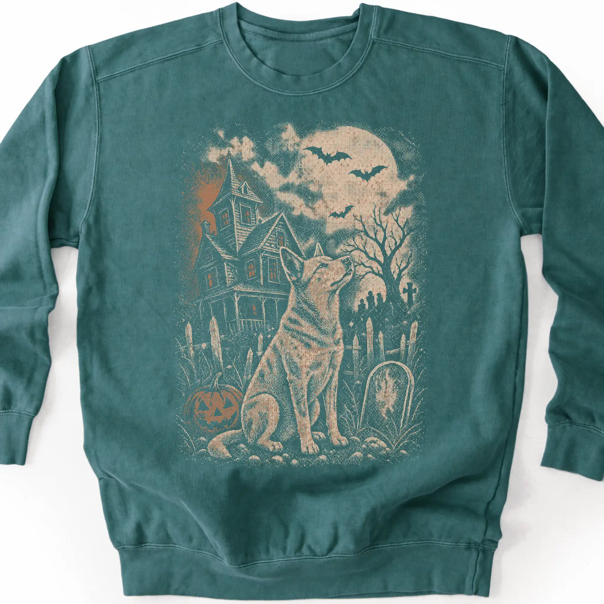 Blue Heeler beside a haunted house on a blue spruce sweatshirt.