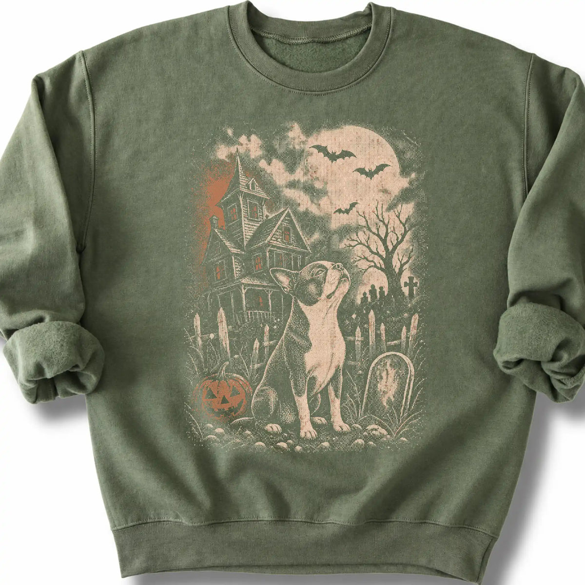 Boston Terrier beside a haunted house on a military green sweatshirt.