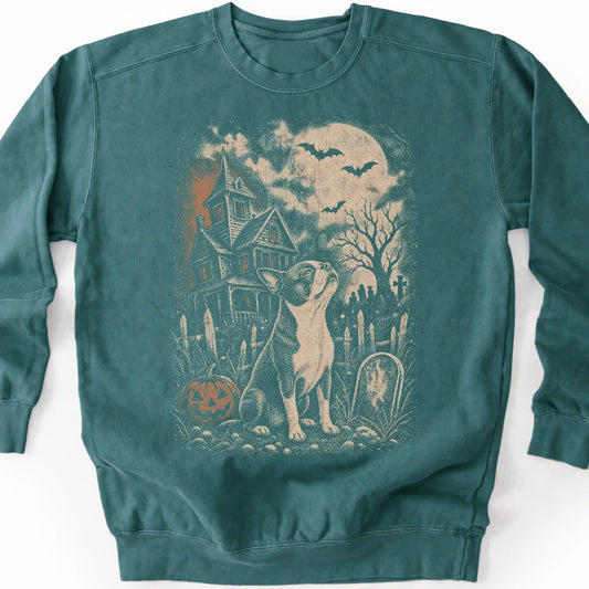 Boston Terrier beside a haunted house on a blue spruce sweatshirt.