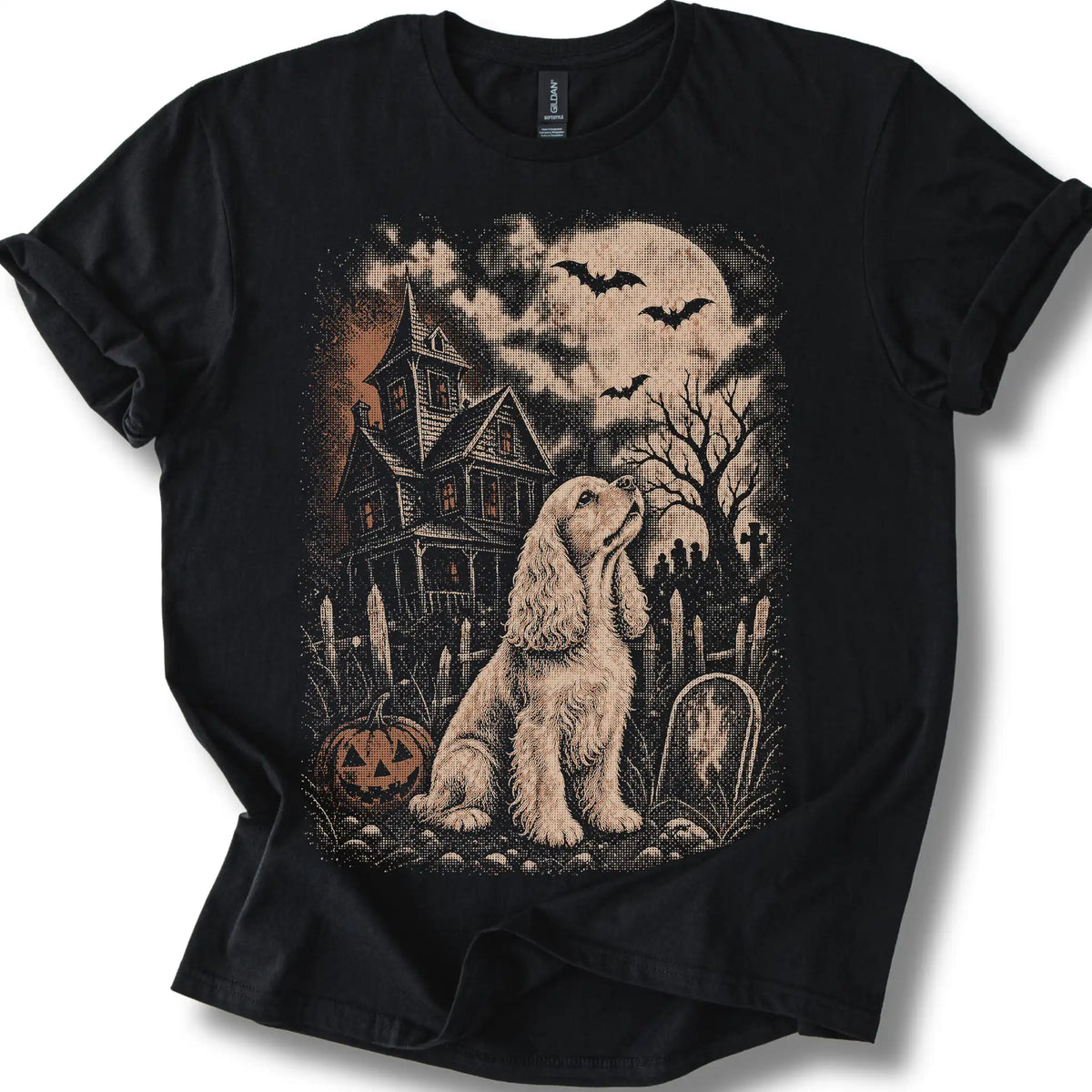 Cocker Spaniel beside a haunted house on a black T-shirt.