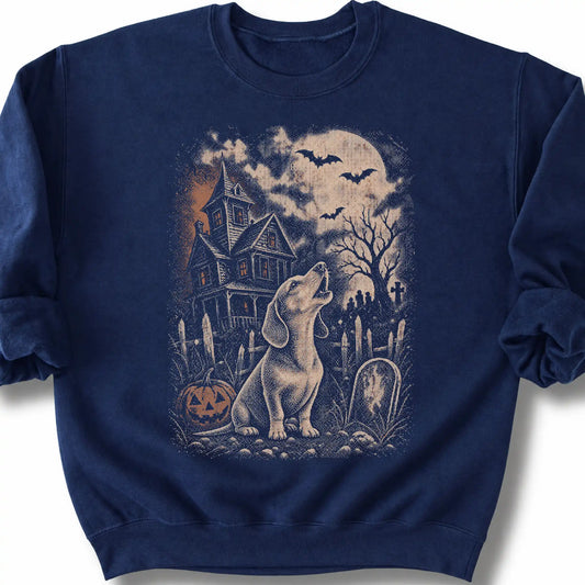 Dachshund beside a haunted house on a navy sweatshirt.