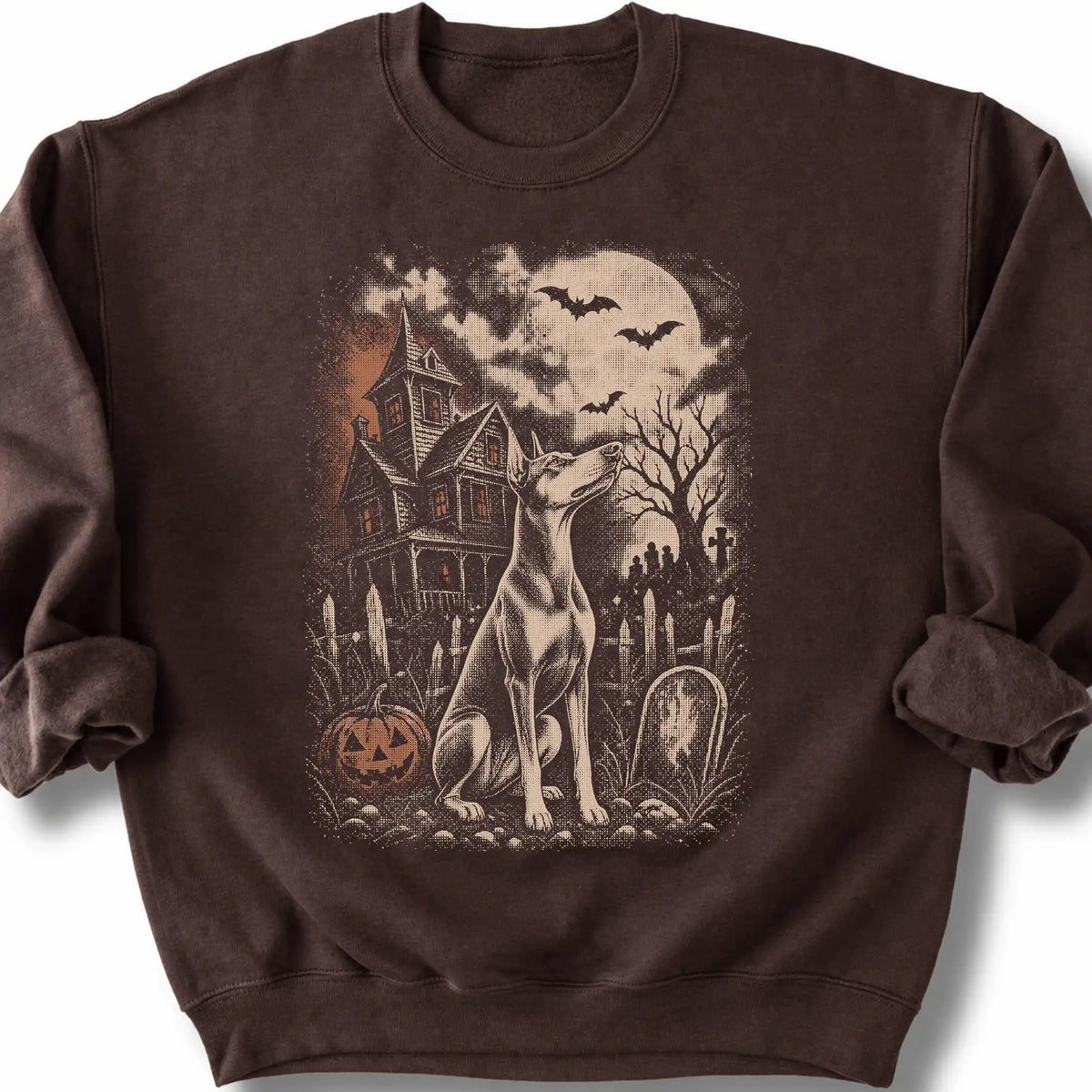 Doberman beside a haunted house on a dark chocolate sweatshirt.