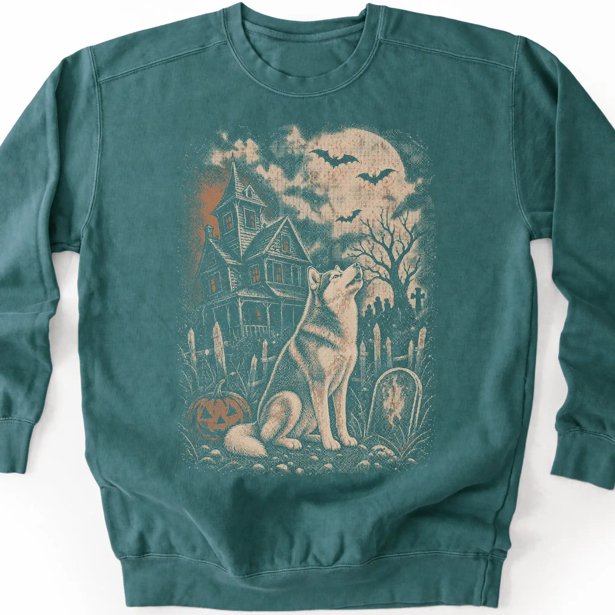 Husky beside a haunted house on a blue spruce sweatshirt.