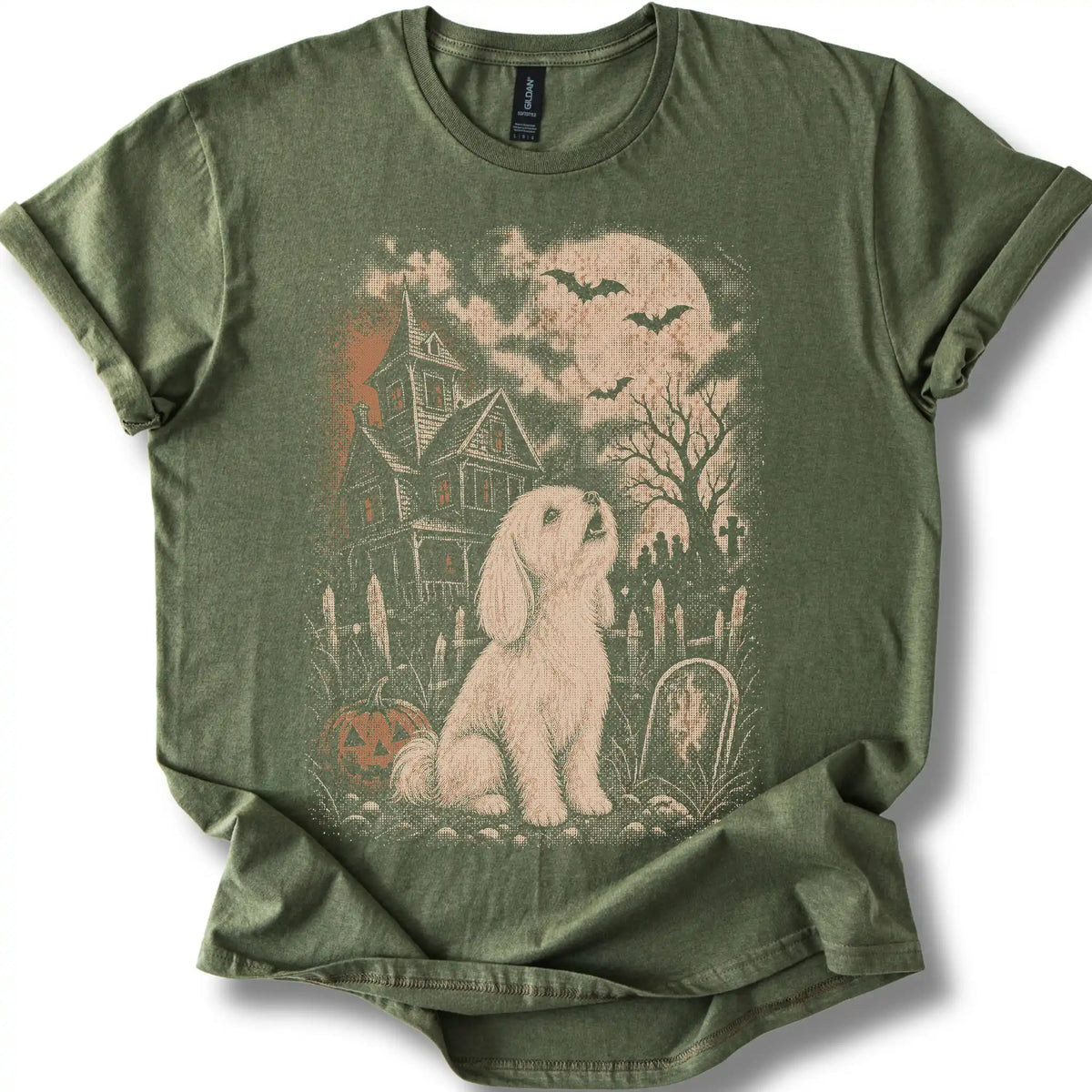 Maltese beside a haunted house on a military green T-shirt.