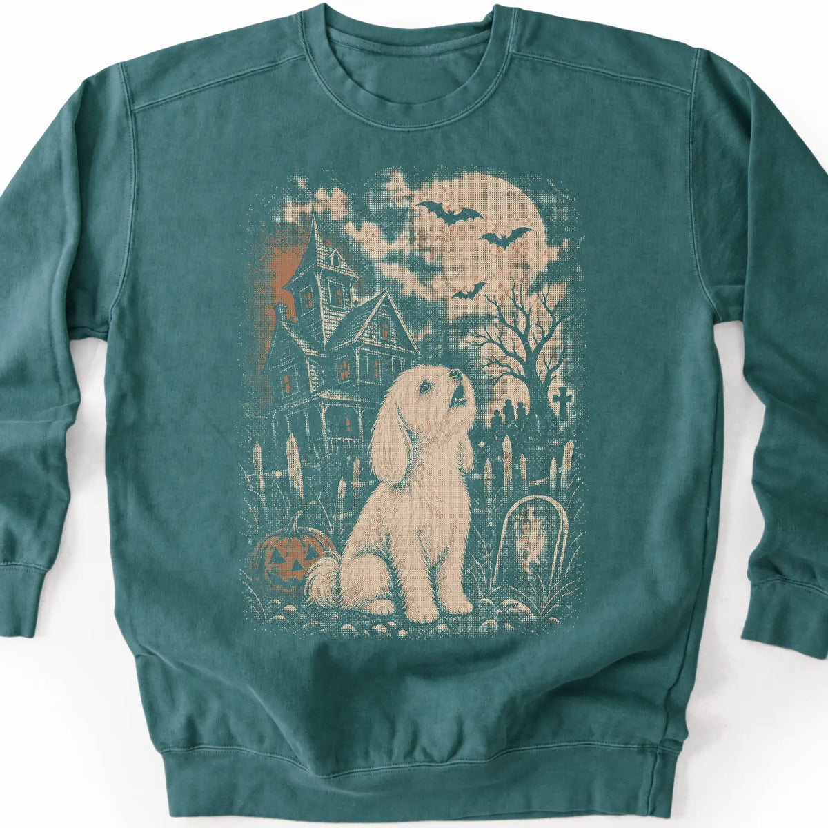 Maltese beside a haunted house on a blue spruce sweatshirt.
