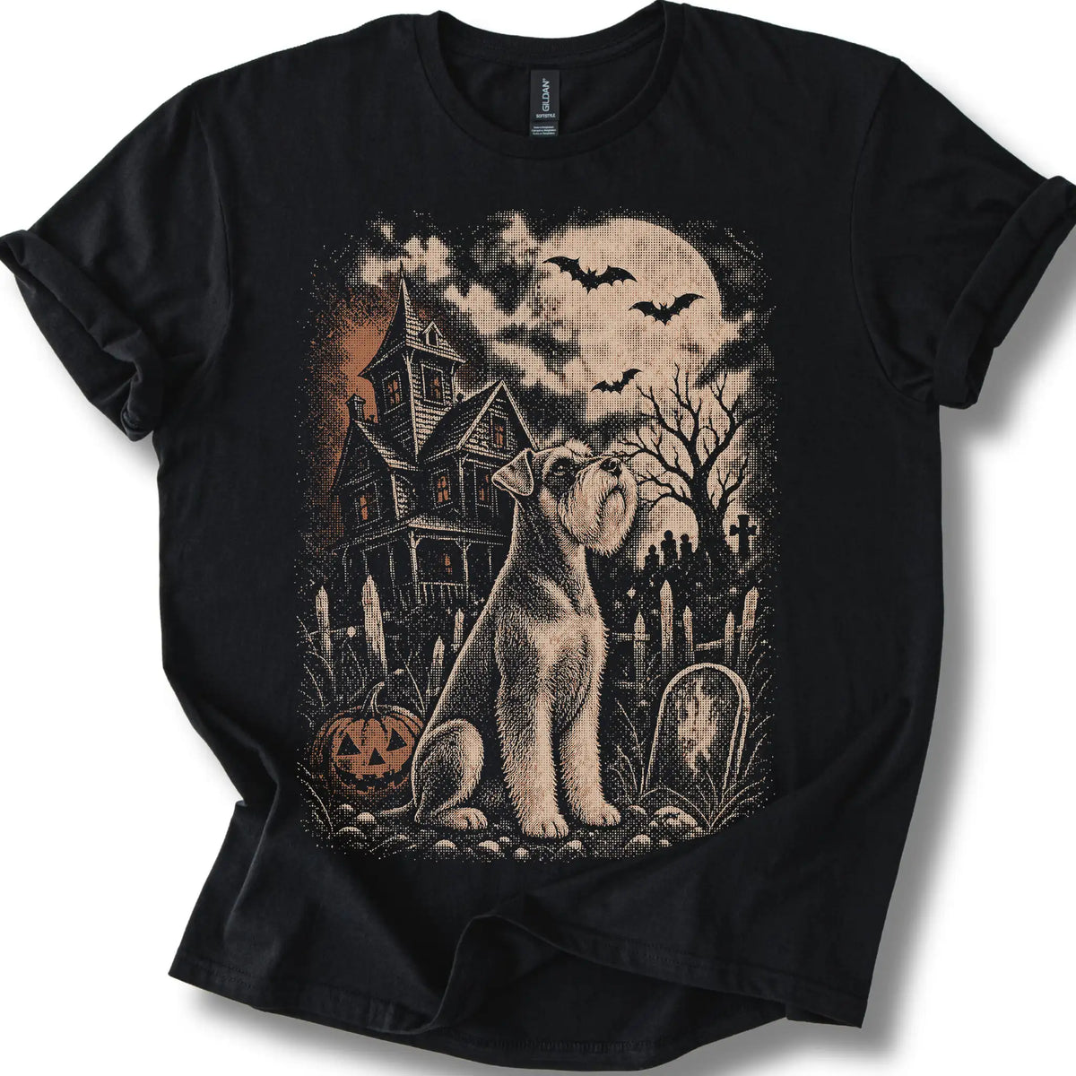 Schnauzer beside a haunted house on a black T-shirt.