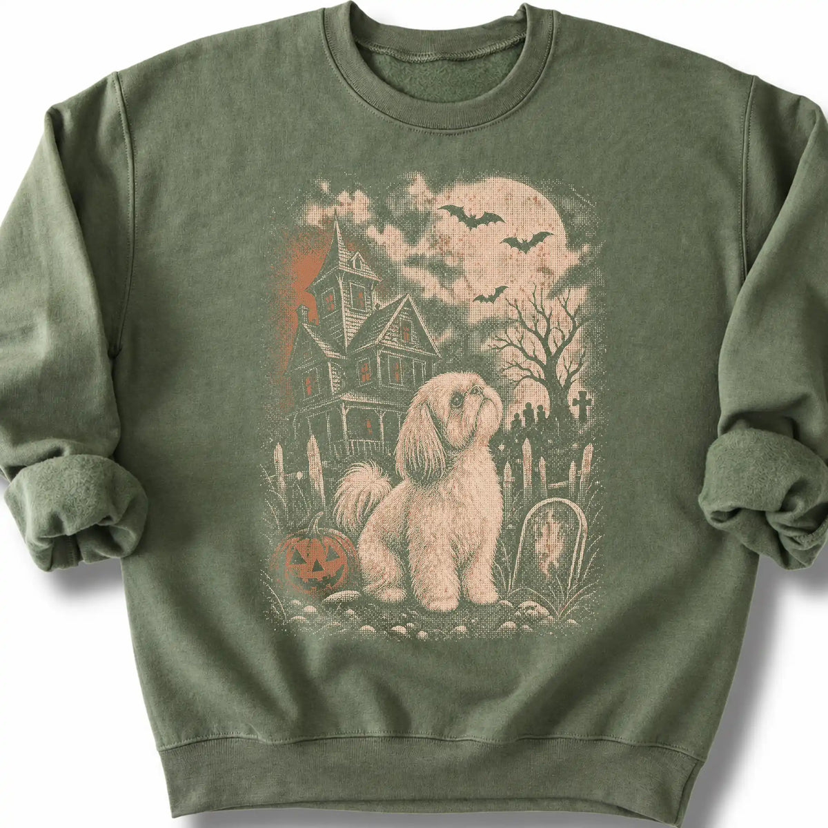 Shih Tzu beside a haunted house on a military green sweatshirt.