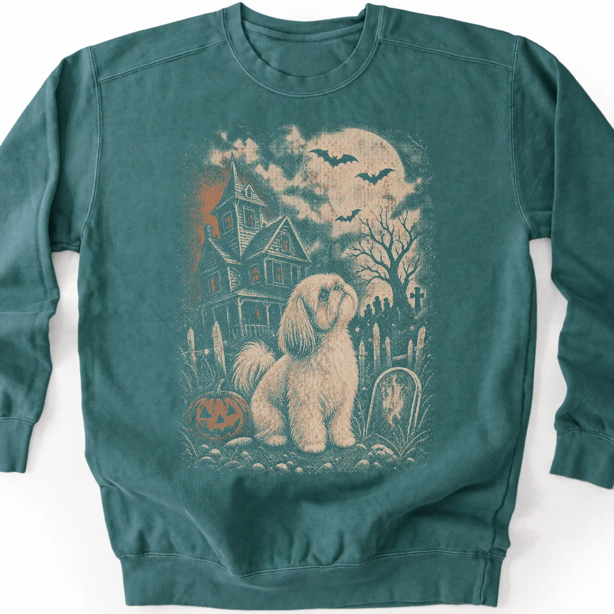 Shih Tzu beside a haunted house on a blue spruce sweatshirt.