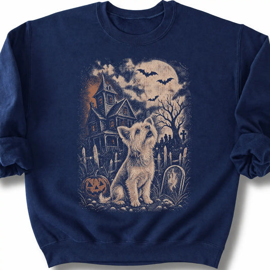 Yorkie beside a haunted house on a navy sweatshirt.