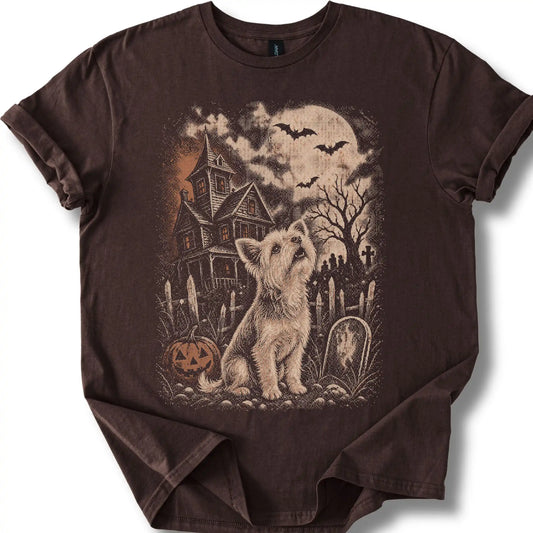 Yorkie beside a haunted house on a dark chocolate T-shirt.