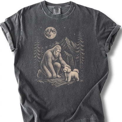 Bichon Frise Bigfoot Petting on a Pepper T-shirt, shown flat