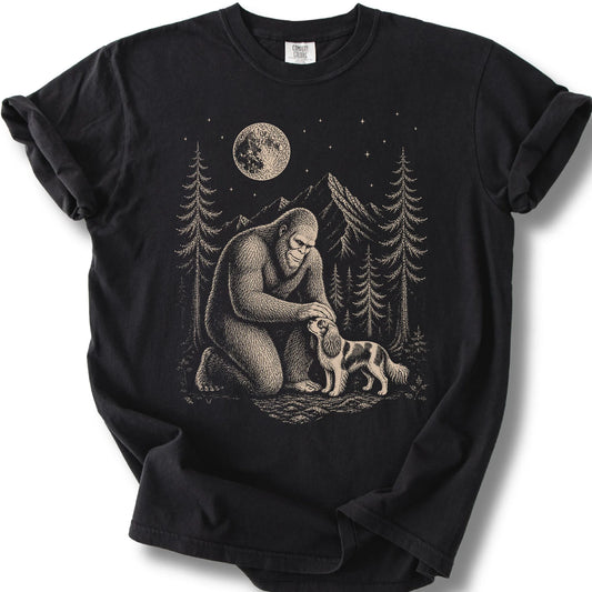 Cavalier King Charles Spaniel Bigfoot Petting on a Black T-shirt, shown flat