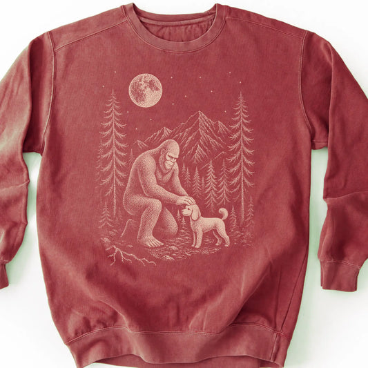 Poodle Bigfoot Petting on a Crimson crewneck sweatshirt, shown flat
